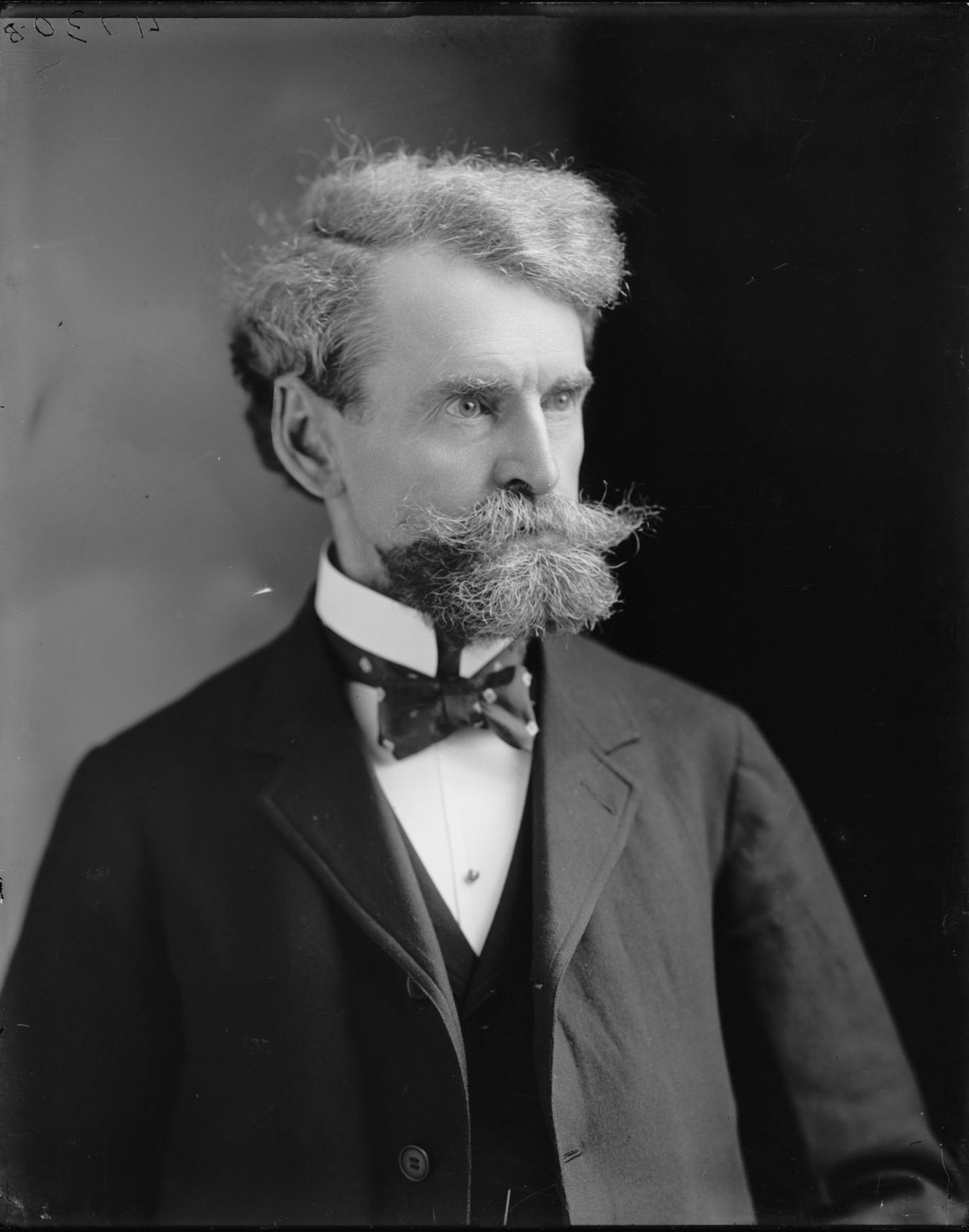Portrait of Copper King William Andrews Clark, white-haired with a large mustache and goatee