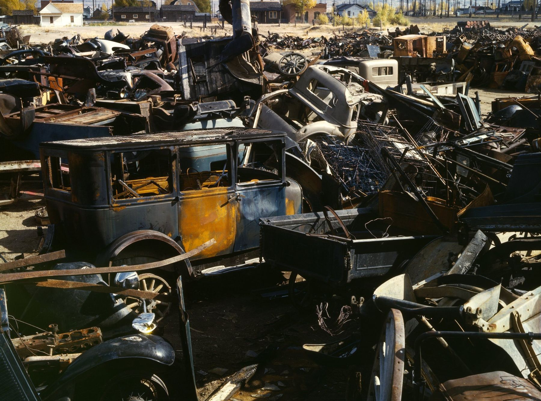 Kodachrome color photograph of rusting automobiles piled in a Butte scrap and salvage yard, October 1942